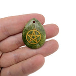 Pentagram engraved crystal pendant from GemstoneGO, drilled for hanging, symbolizing protection and balance in pagan traditions.