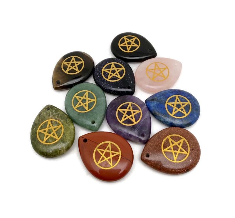 Crystal with pentagram engraving from GemstoneGO, drilled for protection and balance, featuring a clear, polished appearance.