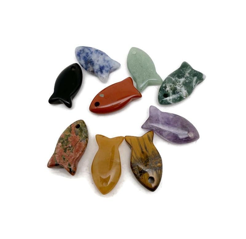 Fish-shaped crystal pendant from GemstoneGO featuring a healing stone design, perfect for jewelry and accessories.