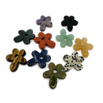 Carved crystal flower gemstone pendant with colorful gemstone accents, featuring a detailed floral design on a silver chain.