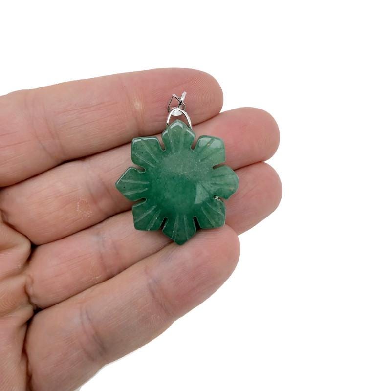 Snowflake gemstone pendant from GemstoneGO featuring a healing stone with a delicate silver setting.