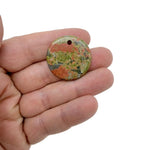 Round gemstone pendant featuring a drilled natural crystal disc charm, showcasing vibrant colors and polished surface by GemstoneGO.