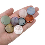 Round gemstone pendant featuring a drilled natural crystal disc charm with colorful mixed gemstones, crafted by GemstoneGO.