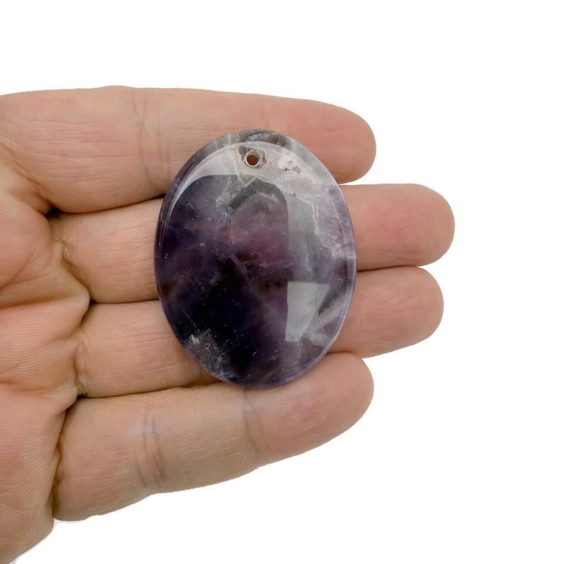 Healing worry crystal pendant featuring a natural stone on a cord, part of GemstoneGO's gemstone jewelry collection.