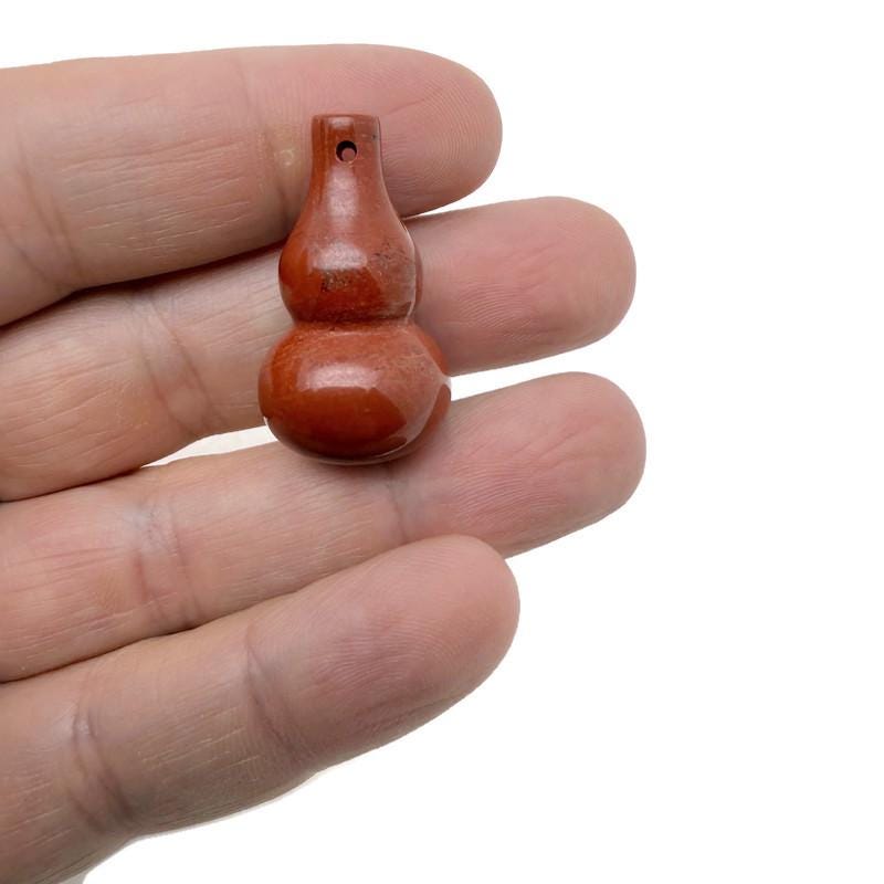 Wu Lou crystal pendant featuring a gemstone gourd design, showcasing vibrant colors and intricate craftsmanship by GemstoneGO.