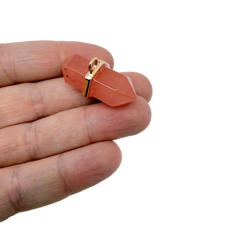 Natural double terminated crystal pendant from GemstoneGO, showcasing a clear gemstone point with unique natural markings.