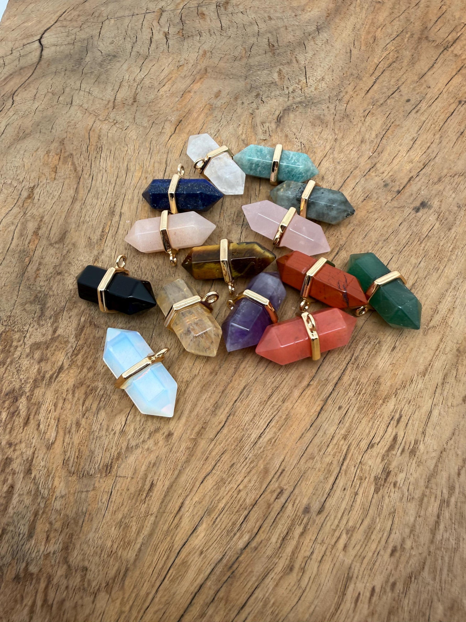 Natural double terminated crystal pendant featuring a gemstone point, showcasing clear quartz with unique natural formations.