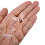 Pink rose quartz fish-shaped crystal pendant with a silver bail, designed for jewelry, showcasing a healing stone charm.