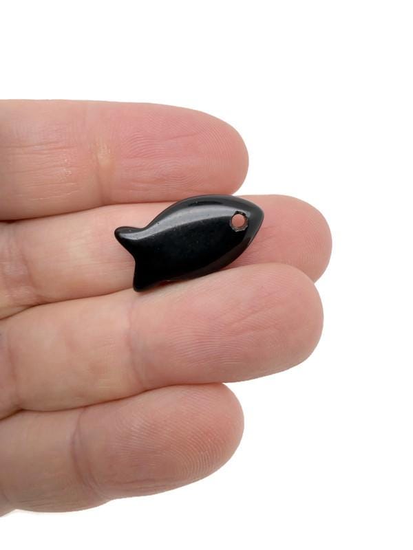 Obsidian fish-shaped crystal pendant with gemstone charm, featuring a dark, polished healing stone design for jewelry.
