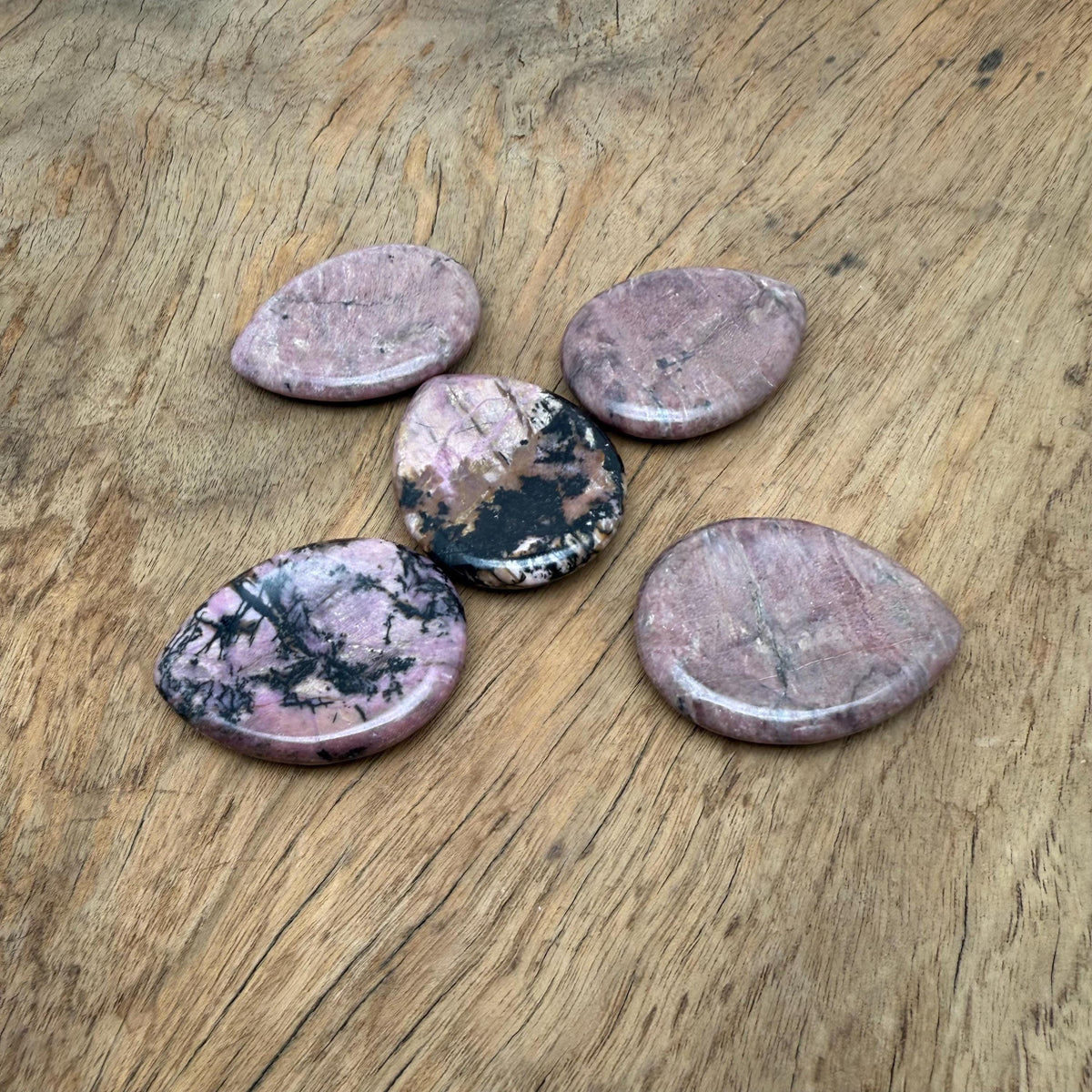 Rhodonite worry stone from GemstoneGO, 45mm soothing crystal with polished, smooth surface for stress relief and meditation.