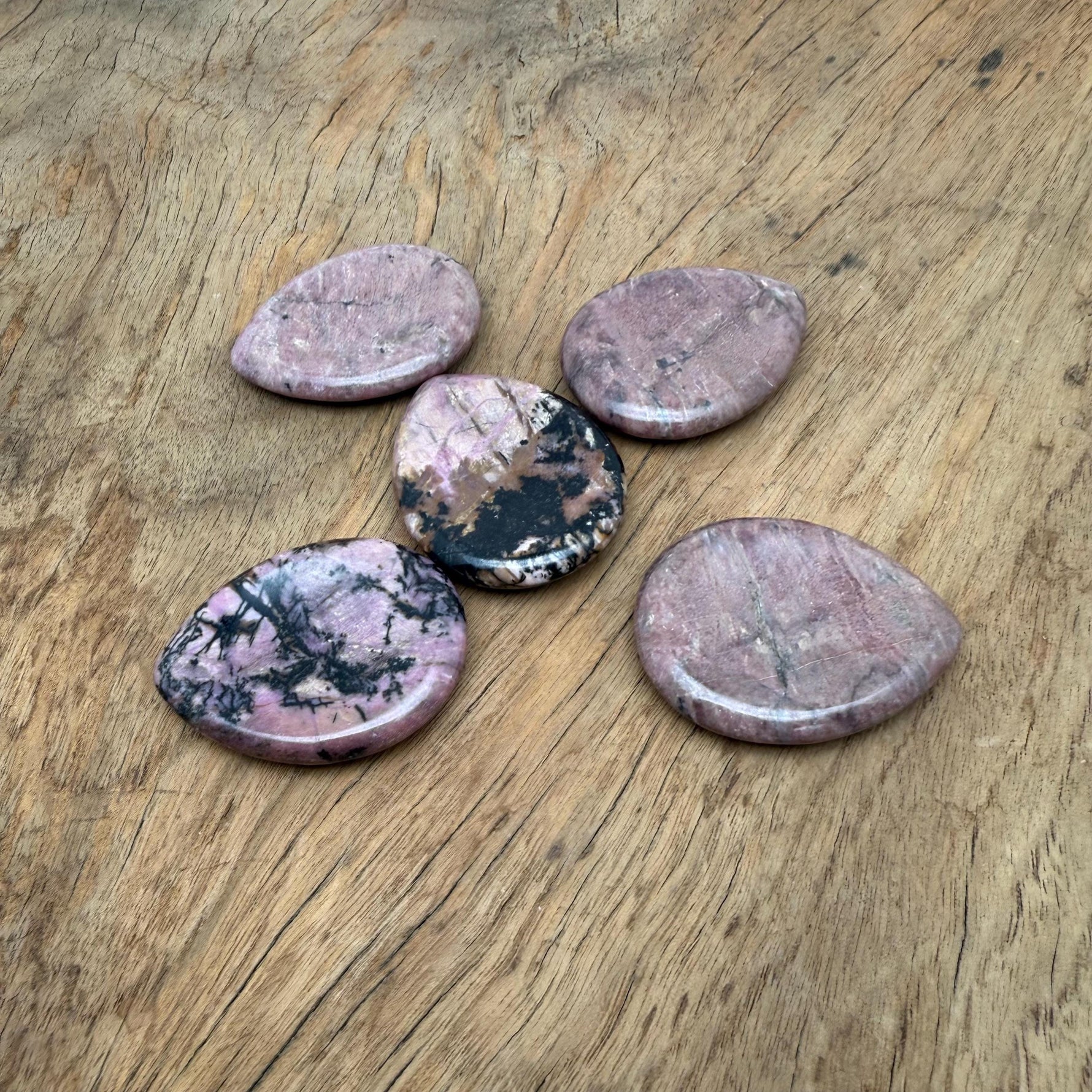 Rhodonite worry stone from GemstoneGO, 45mm soothing crystal with polished, smooth surface for stress relief and meditation.