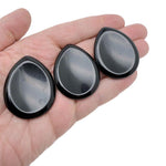 Obsidian worry stone from GemstoneGO, 45mm soothing crystal with polished smooth surface for stress relief and meditation.