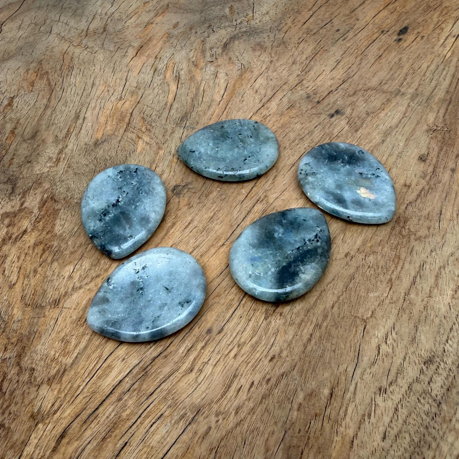 Smooth Labradorite worry stone, 45mm soothing crystal from GemstoneGO, featuring iridescent blue and green flashes in a polished oval shape.