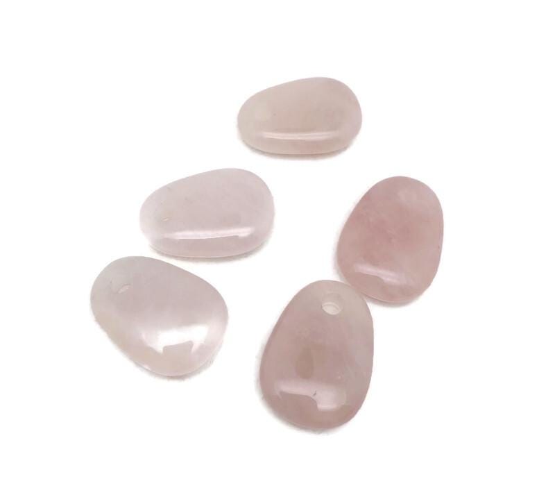 Oval rose quartz crystal pendant from GemstoneGO, showcasing a smooth, polished natural stone jewelry making bead.
