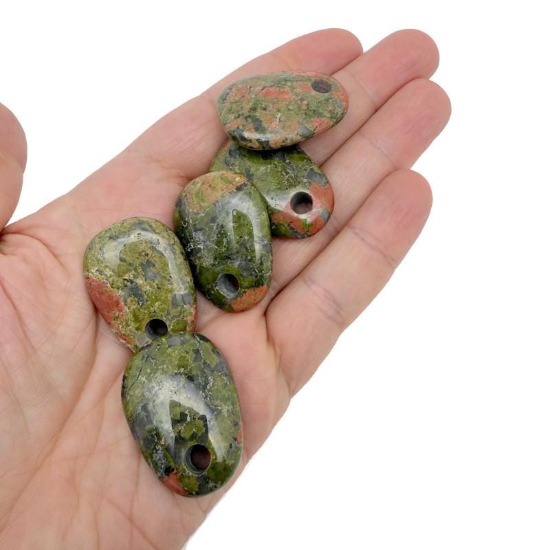 Unakite oval crystal pendant from GemstoneGO, showcasing a natural stone jewelry bead with green and pink hues.
