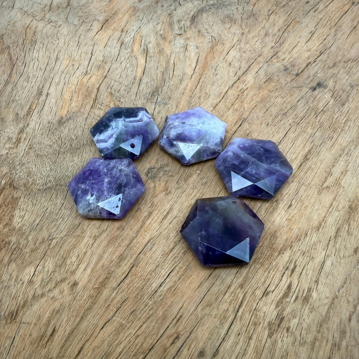 Faceted amethyst hexagon crystal pendant necklace with a gemstone bead, showcasing a purple gemstone from GemstoneGO.