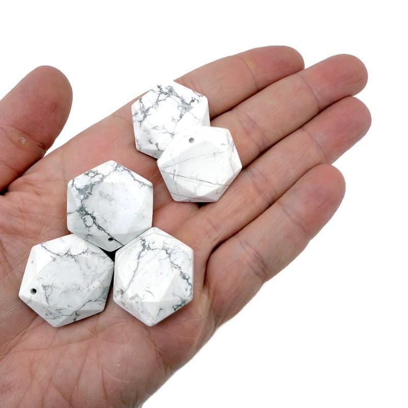 Faceted howlite hexagon crystal pendant necklace with a smooth stone bead, featuring a natural white and gray marbled pattern.