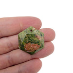 Faceted unakite hexagon crystal pendant necklace with gemstone bead from GemstoneGO, showcasing a polished green and pink stone.