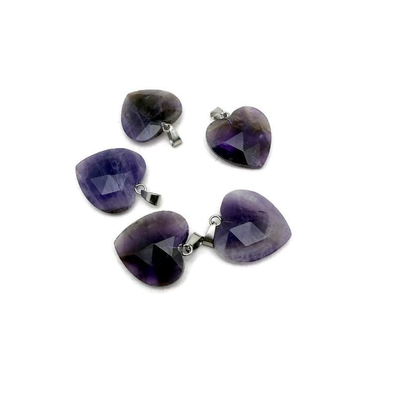 Faceted amethyst heart crystal pendant from GemstoneGO, showcasing a natural purple crystal charm with a silver bail.