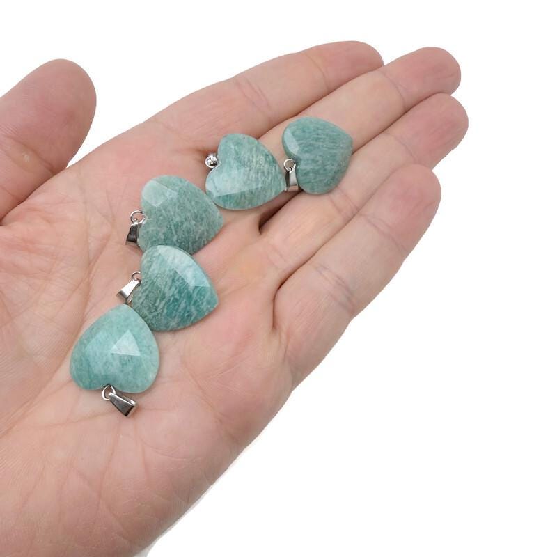 Faceted Amazonite heart crystal pendant from GemstoneGO featuring a natural crystal charm on a silver chain.