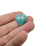 Faceted Amazonite heart crystal pendant from GemstoneGO featuring a natural, polished gemstone charm on a silver chain.