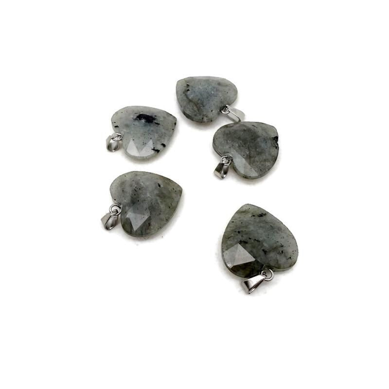 Labradorite faceted heart crystal pendant from GemstoneGO showcasing a natural, shimmering gemstone with a silver bail.