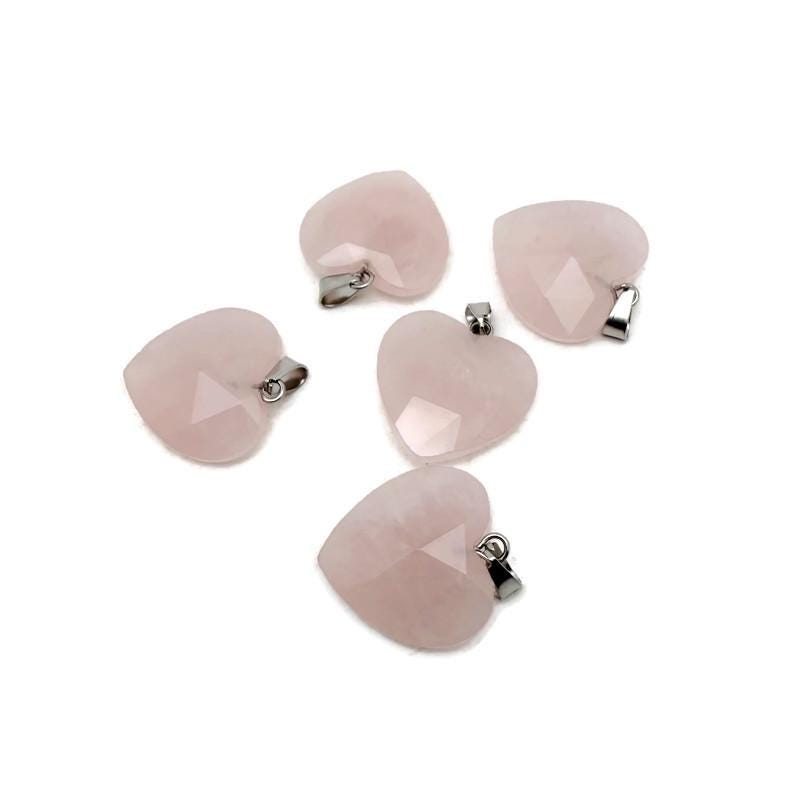 Faceted rose quartz heart crystal pendant from GemstoneGO, showcasing a natural pink gemstone charm with detailed facets.