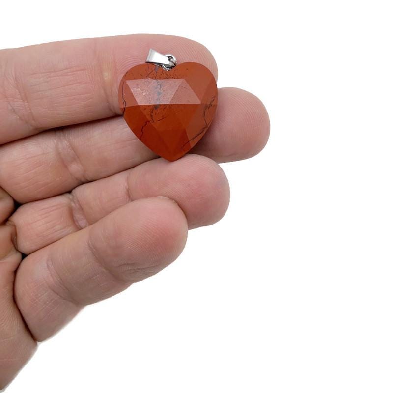 Faceted red Jasper heart crystal pendant from GemstoneGO, featuring a natural gemstone charm with detailed faceting and vibrant red color.