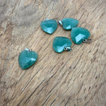 Faceted aventurine heart crystal pendant by GemstoneGO, showcasing a natural green gemstone charm with detailed facets.