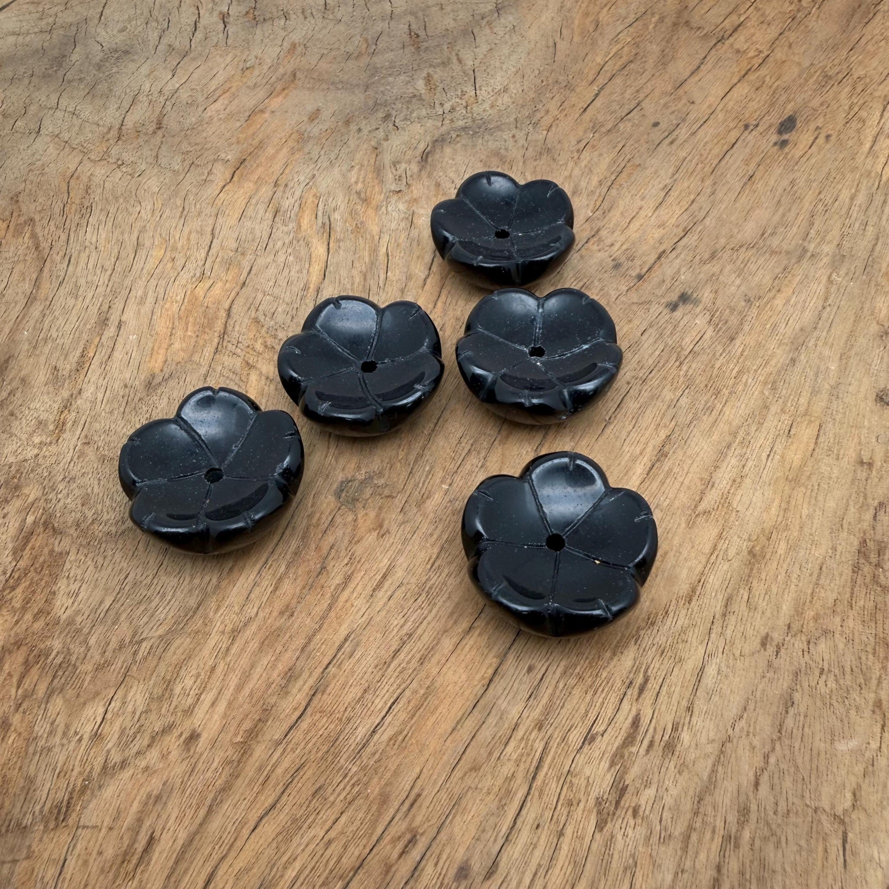 Obsidian crystal flower-shaped incense holder by GemstoneGO for cleansing and relaxation, featuring intricate carved details.