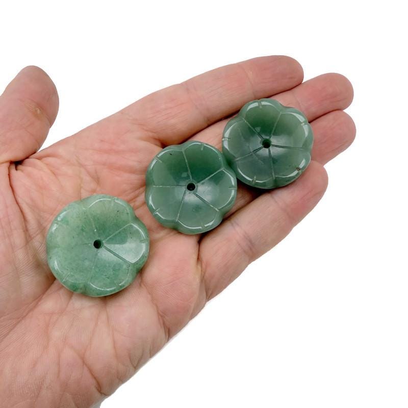 Aventurine crystal flower-shaped incense holder by GemstoneGO, designed for cleansing and relaxation, with carved details and a hollow center.