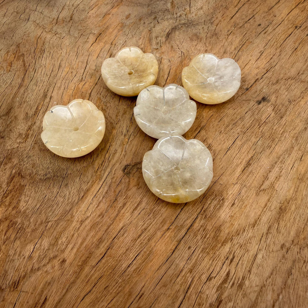 Yellow jade crystal carving incense holder in flower shape, designed for cleansing and relaxation, with a smooth, polished surface.