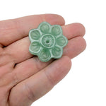 Aventurine natural crystal flower incense holder with carved gemstone design for meditation and stick burning.