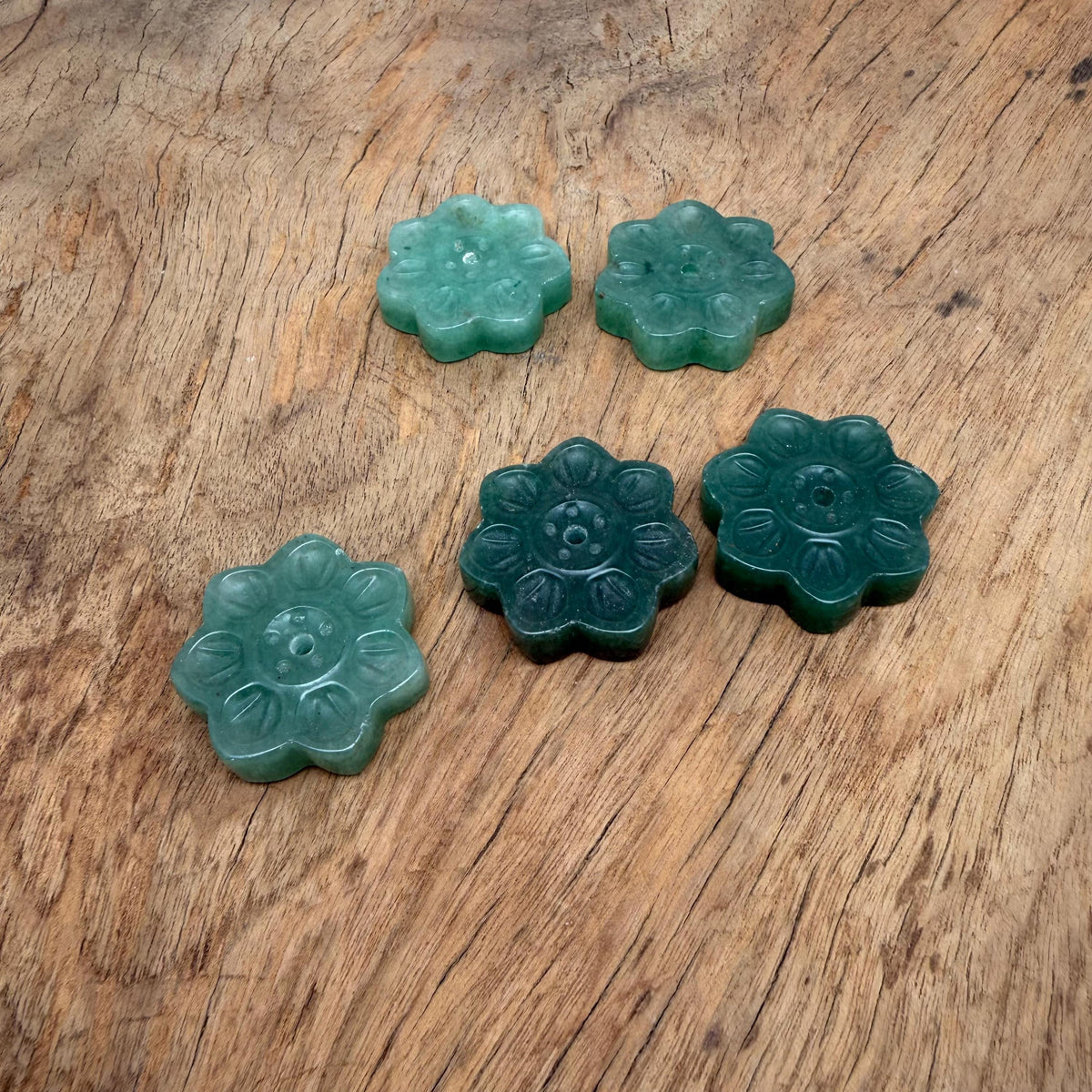 Aventurine crystal flower incense holder by GemstoneGO, carved gemstone stick burner for meditation, with intricate flower design.