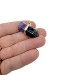 Natural amethyst double terminated crystal pendant with a pointed gemstone from GemstoneGO, showcasing its purple hue and transparent structure.