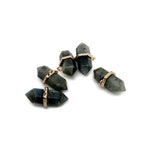 Labradorite double terminated crystal pendant from GemstoneGO featuring a natural gemstone point with iridescent flashes.