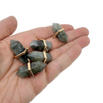 Labradorite double terminated crystal pendant from GemstoneGO, showcasing a natural gemstone point with iridescent flashes.