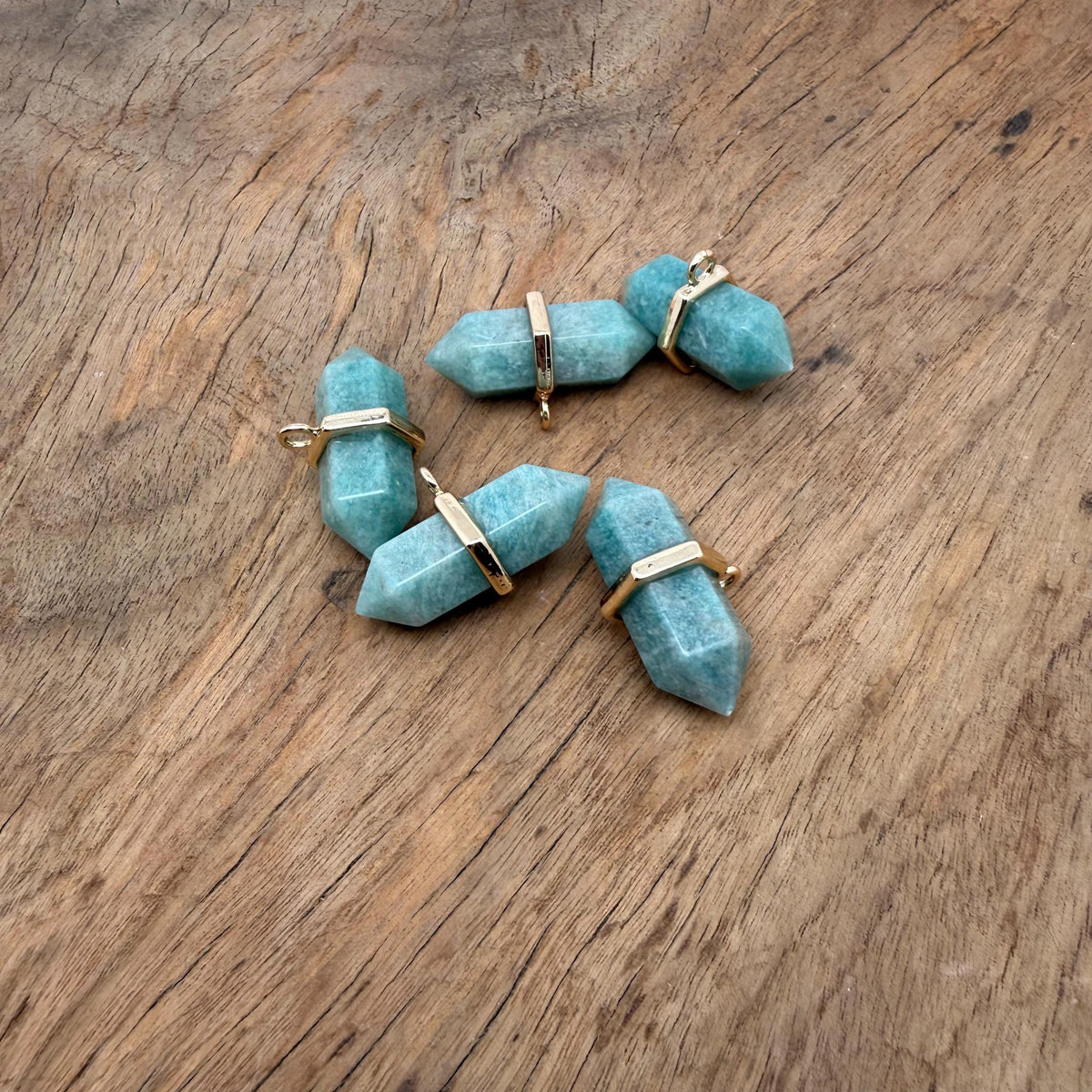 Amazonite double terminated crystal pendant by GemstoneGO, showcasing a natural gemstone point with vibrant blue-green hues.
