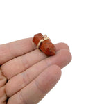 Red Jasper double terminated crystal pendant from GemstoneGO featuring a natural gemstone point on a cord.