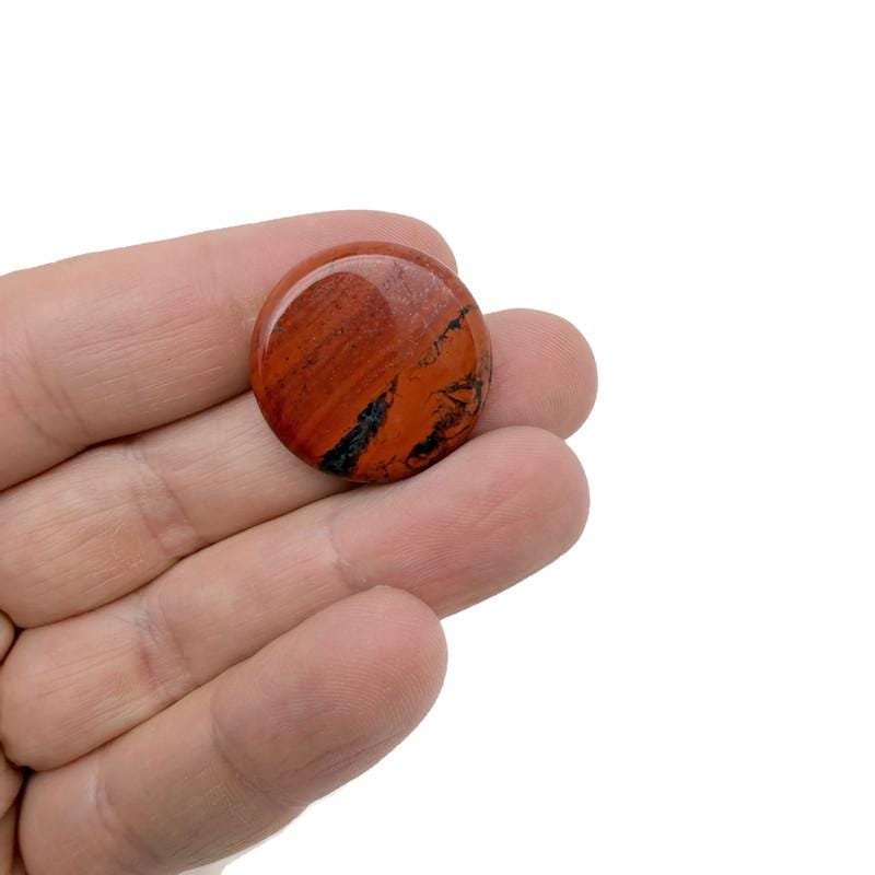Round red jasper gemstone slab, 25mm flat crystal from GemstoneGO, showcasing rich red color and smooth surface.
