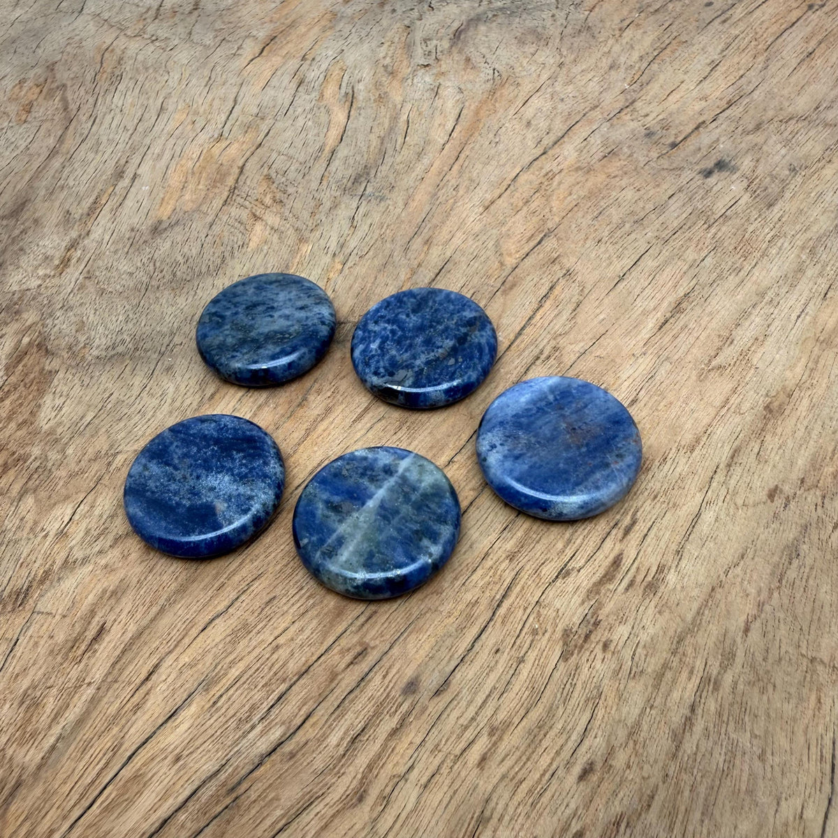 Round Sodalite flat gemstone slab, 25mm, from GemstoneGO, showcasing deep blue and white natural stone with smooth polished surface.
