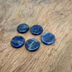 Round Sodalite flat gemstone slab, 25mm, from GemstoneGO, showcasing deep blue and white natural stone with smooth polished surface.