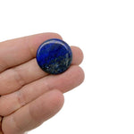 Round lapis lazuli flat gemstone slab, 25mm, showcasing deep blue color with gold pyrite inclusions, from GemstoneGO.