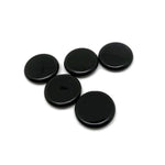 Round obsidian flat gemstone slab, 25mm, from GemstoneGO, showing a smooth, black polished crystal with subtle natural patterns.