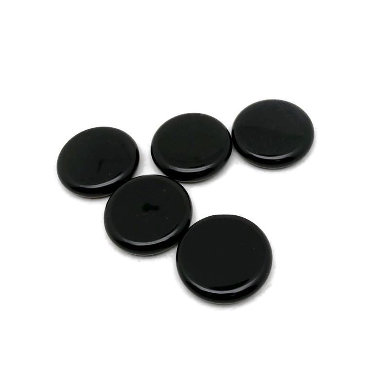 Round obsidian flat gemstone slab, 25mm, from GemstoneGO, showing a smooth, black polished crystal with subtle natural patterns.
