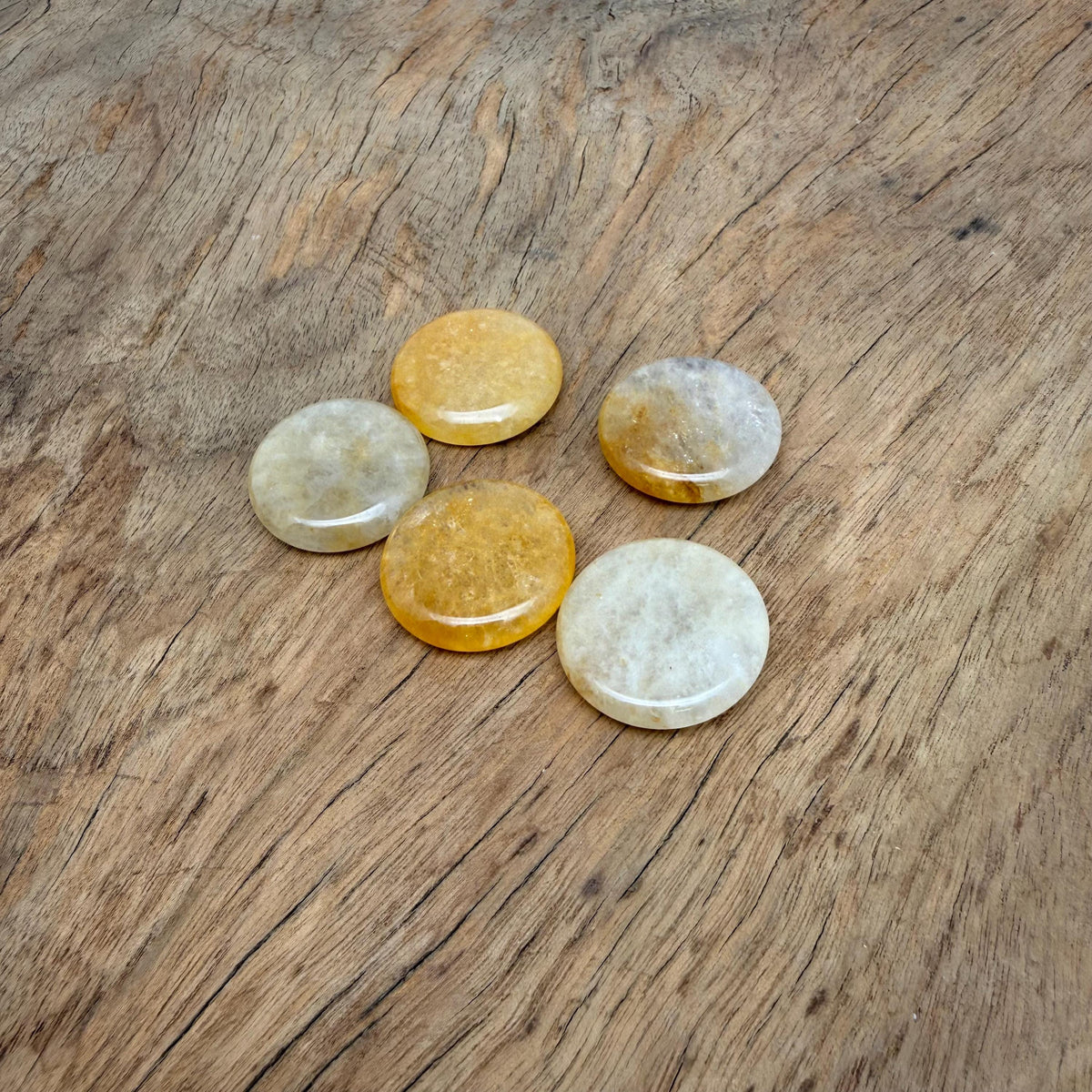Round yellow jade flat gemstone slab, 25mm, showcasing smooth polished surface and vibrant yellow color, by GemstoneGO.