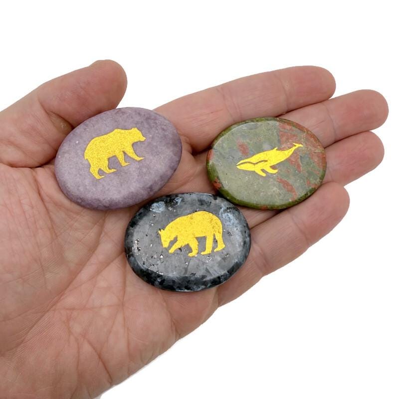 Gold crystal totem stone featuring engraved animal design from GemstoneGO, showcasing a polished, detailed gemstone sculpture.