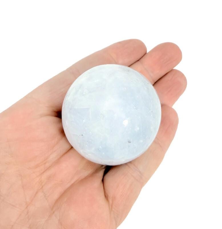 Celestite gemstone sphere, 40-50mm crystal ball from GemstoneGO, showcasing a light blue, semi-translucent mineral with natural patterns.