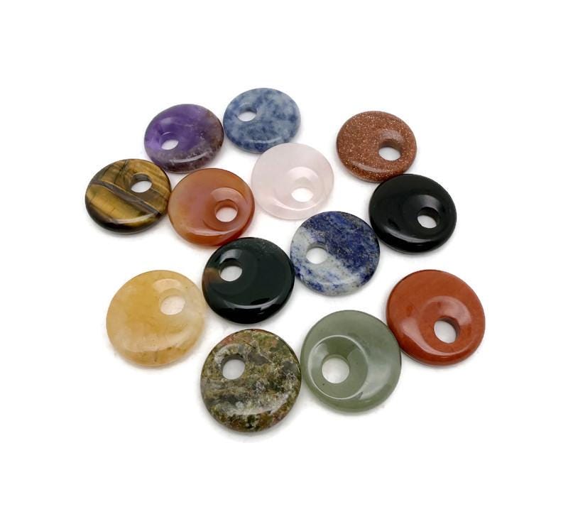 Natural crystal donut pendant with Pi stone charm, 20mm, from GemstoneGO. Features a colorful, mixed gemstone design.