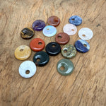 Natural crystal donut charm from GemstoneGO, 20mm Pi Stone design, featuring a colorful mixed gemstone pattern.